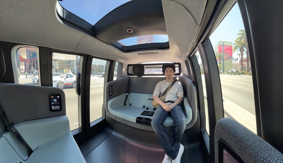 Jonathan seated inside a driverless robotaxi on the Las Vegas Strip